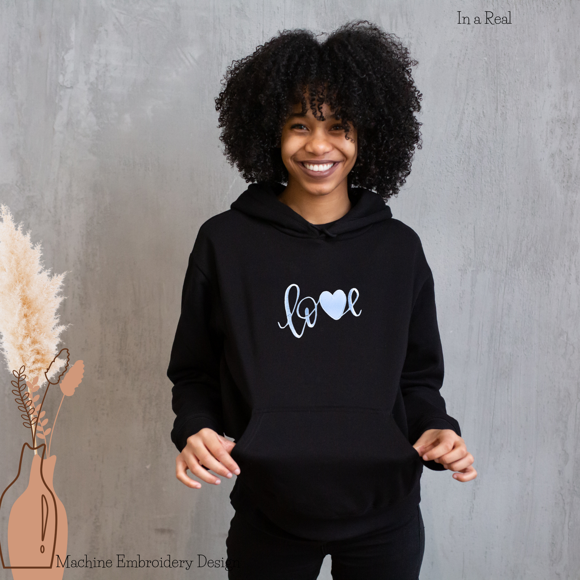 Love with Heart appliqué embroidery design showcased on a hoodie