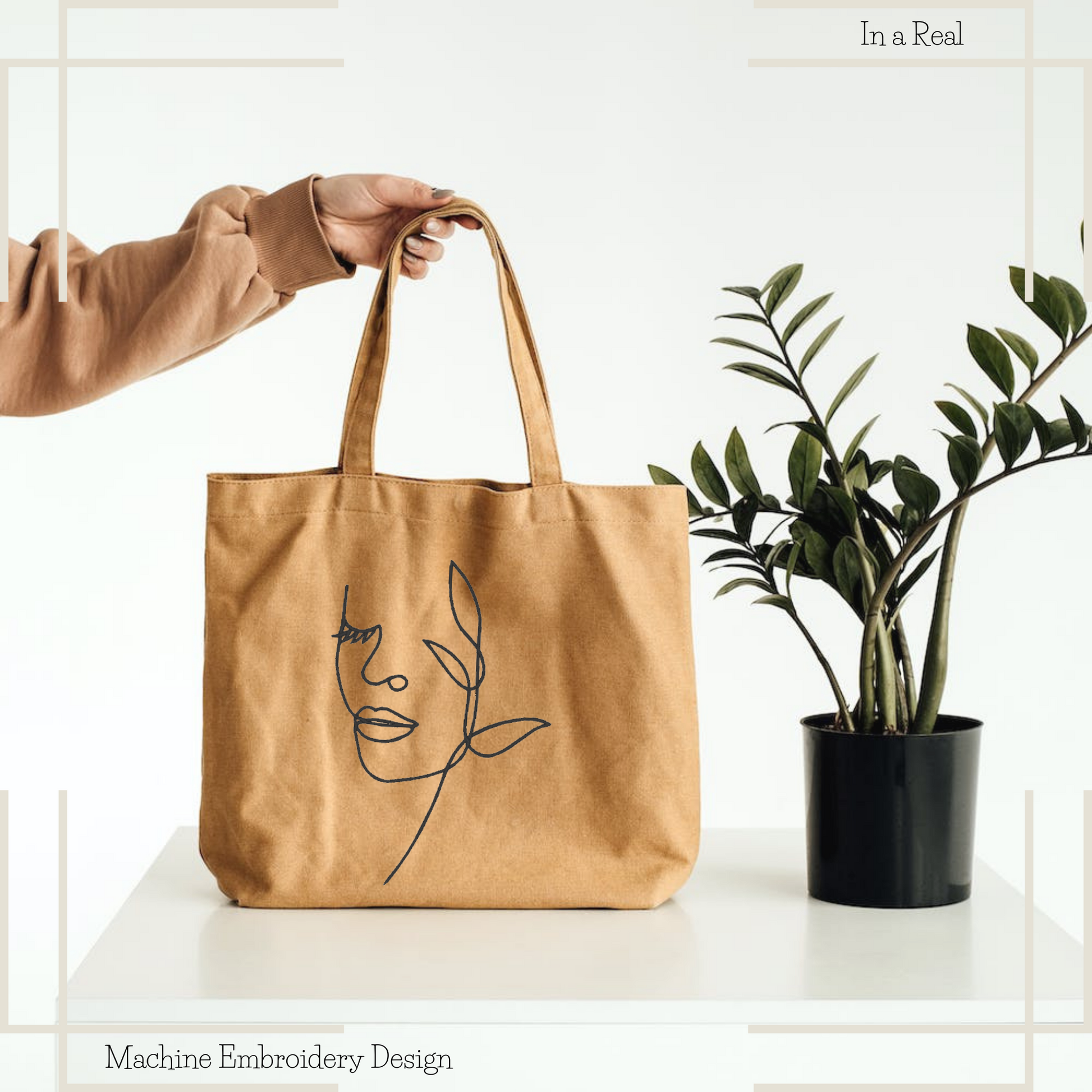 Woman face by flower line art machine embroidery design is displayed on a tote bag