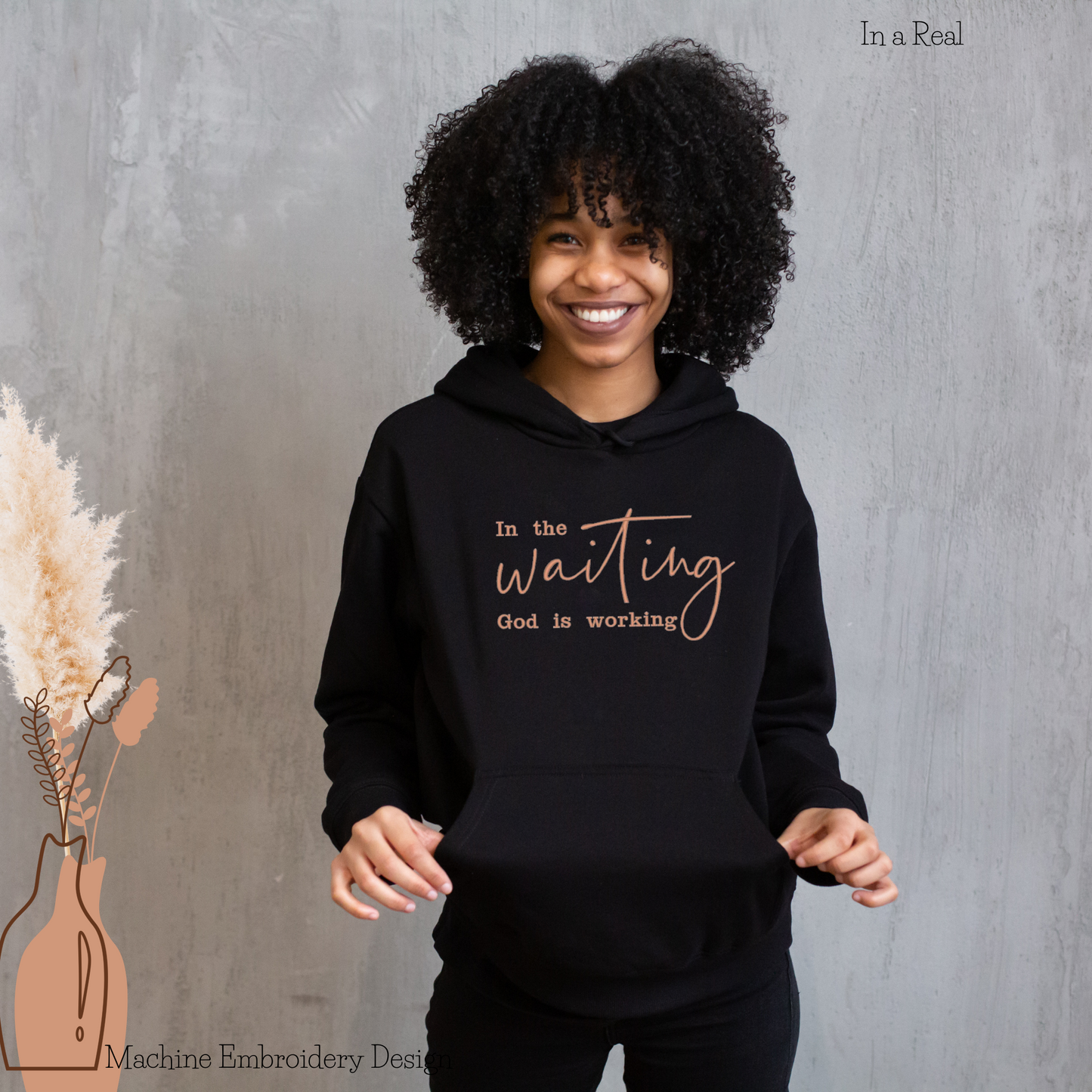 "In the Waiting God is working" Machine Embroidery Design displayed on a hoodie