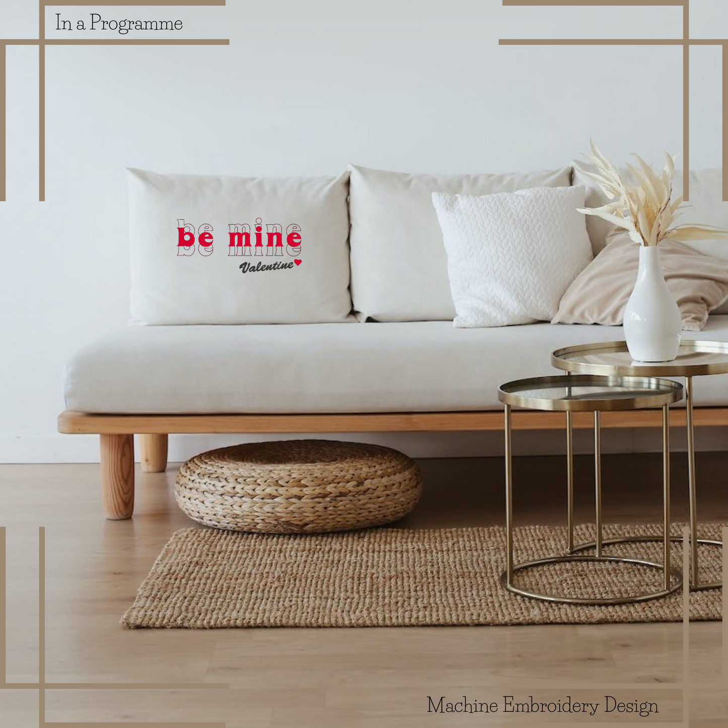 The 'Be Mine Valentine' Machine Embroidery Design graces a decorative pillow