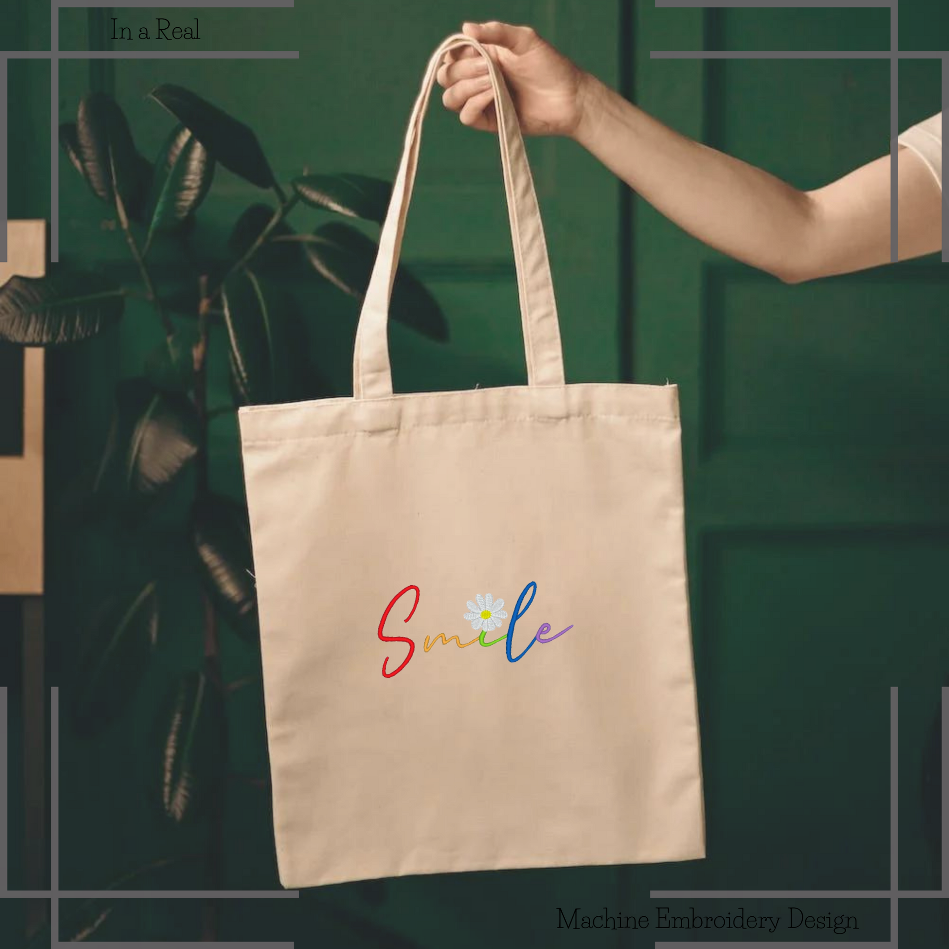 The Rainbow Smile Embroidery Design on a tote bag showcases the word 'Smile' in colorful letters, with a chamomile flower replacing the dot in the 'i'