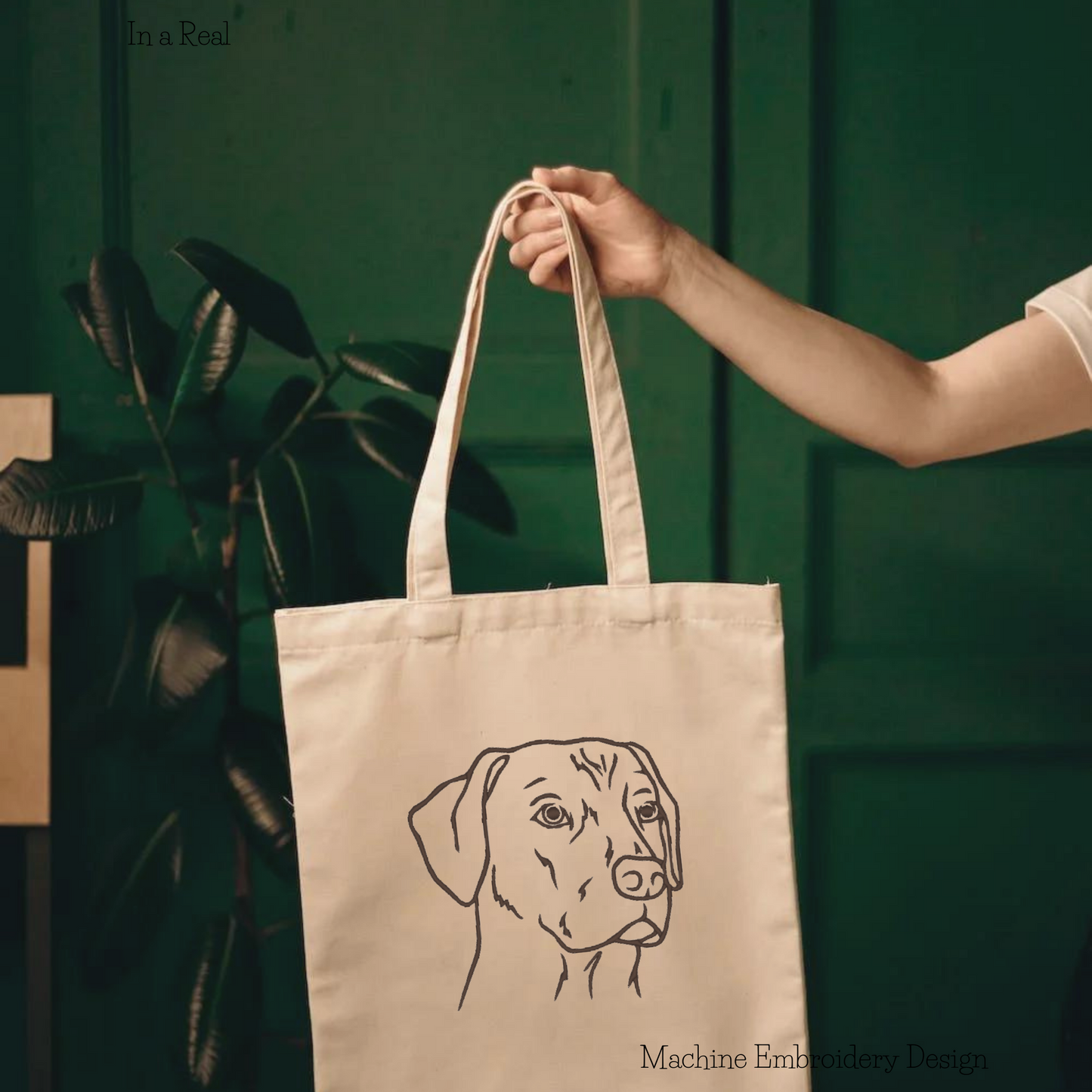 Detailed embroidery design featuring the noble muzzle of a Rhodesian Ridgeback is displayed on a tote bag