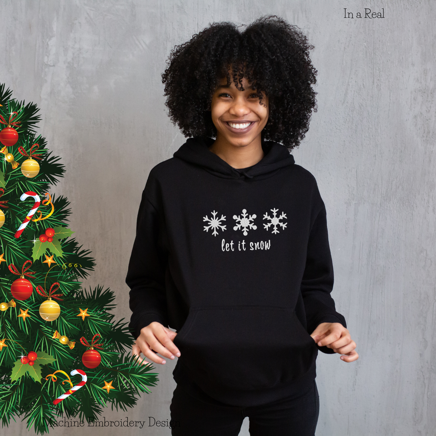 Snowflakes Let it snow machine embroidery design displayed on a hoodie