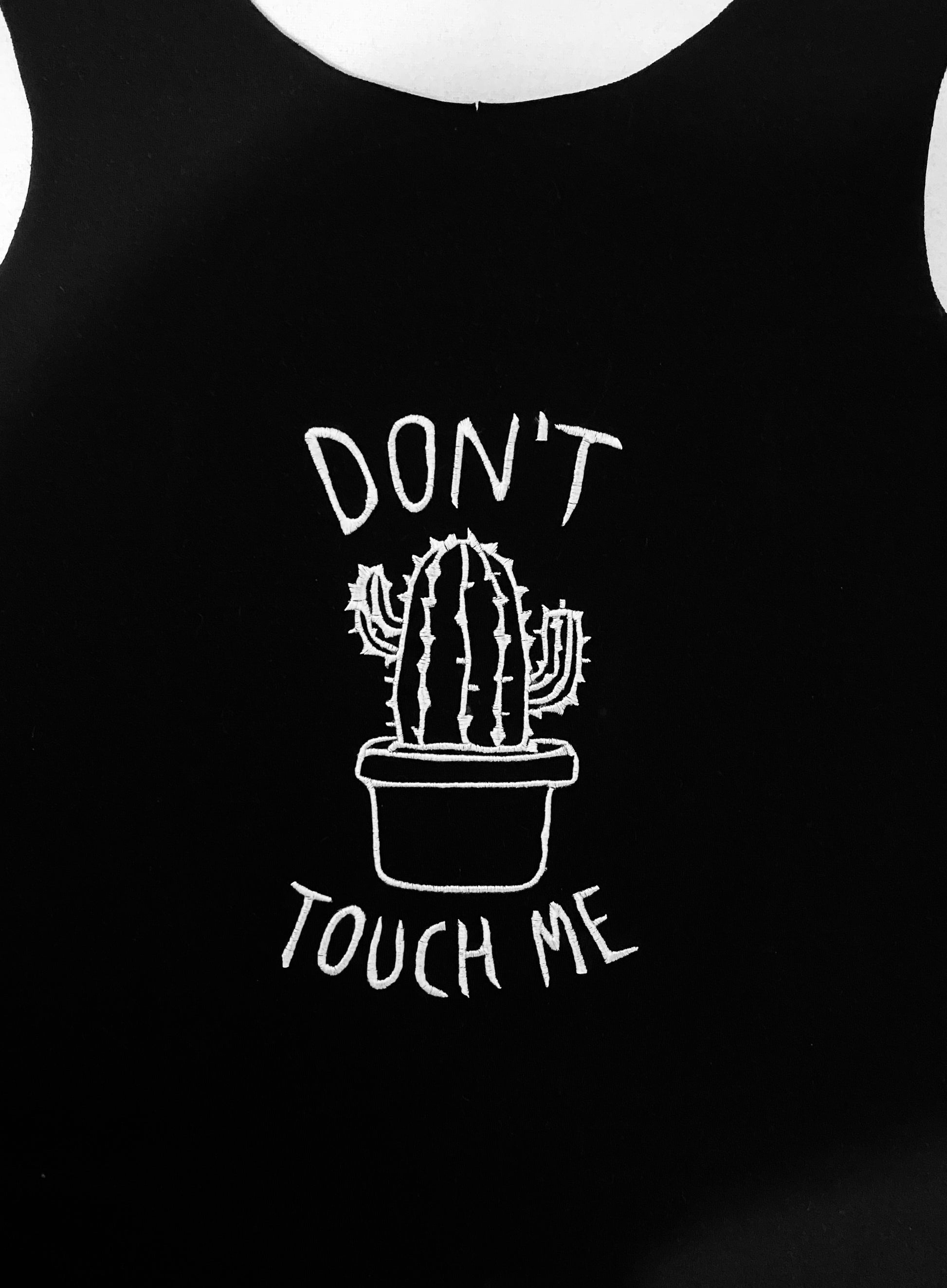 Machine embroidery design depicting a cactus in a pot with 'Don't touch me' text