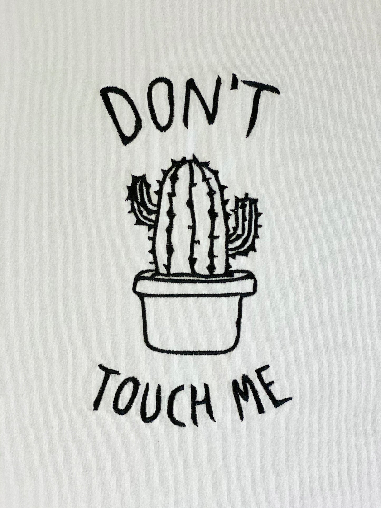 Machine embroidery design depicting a cactus in a pot with 'Don't touch me' text