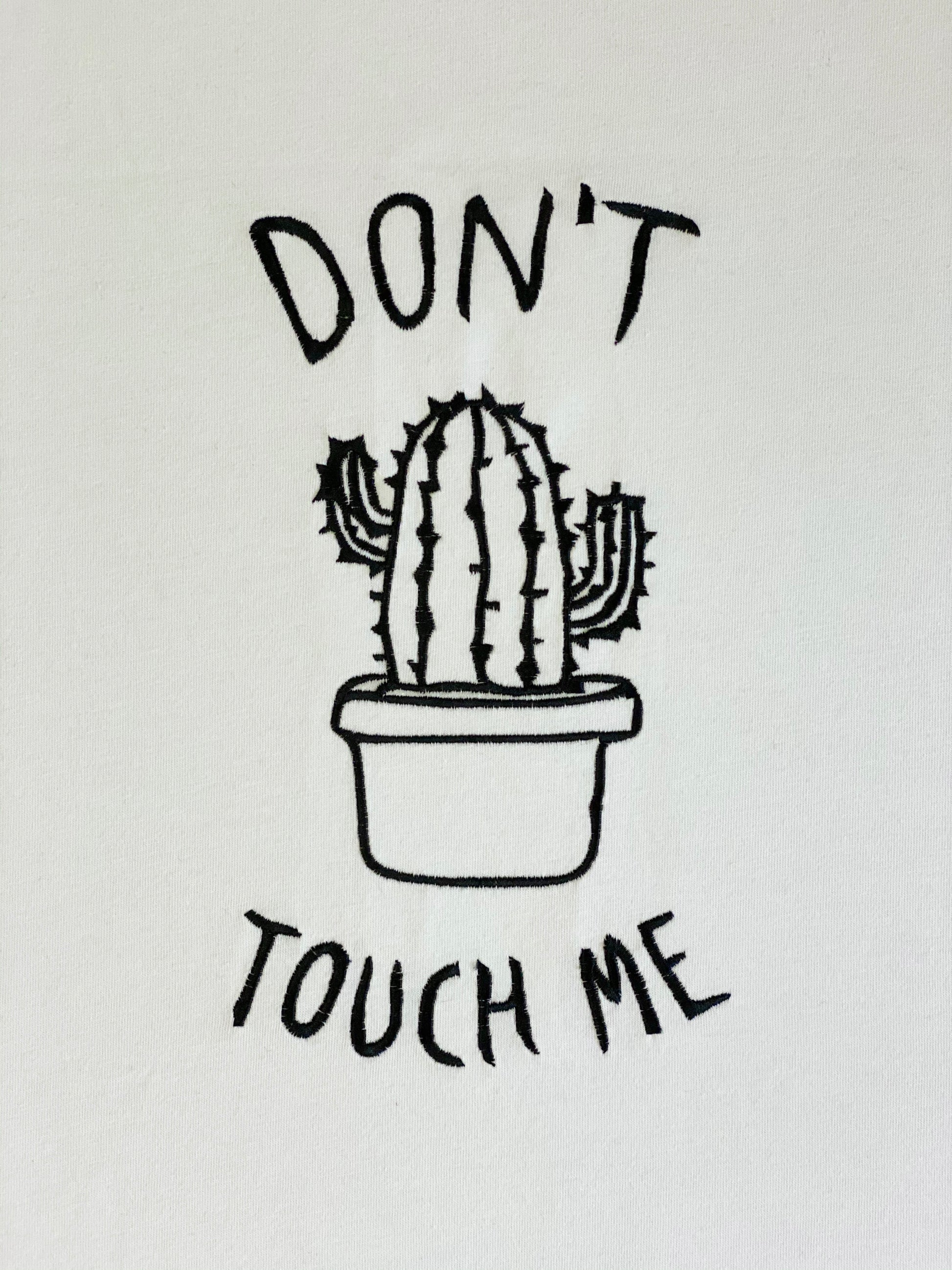 Machine embroidery design depicting a cactus in a pot with 'Don't touch me' text